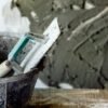 bricklayer-mixing-mortar